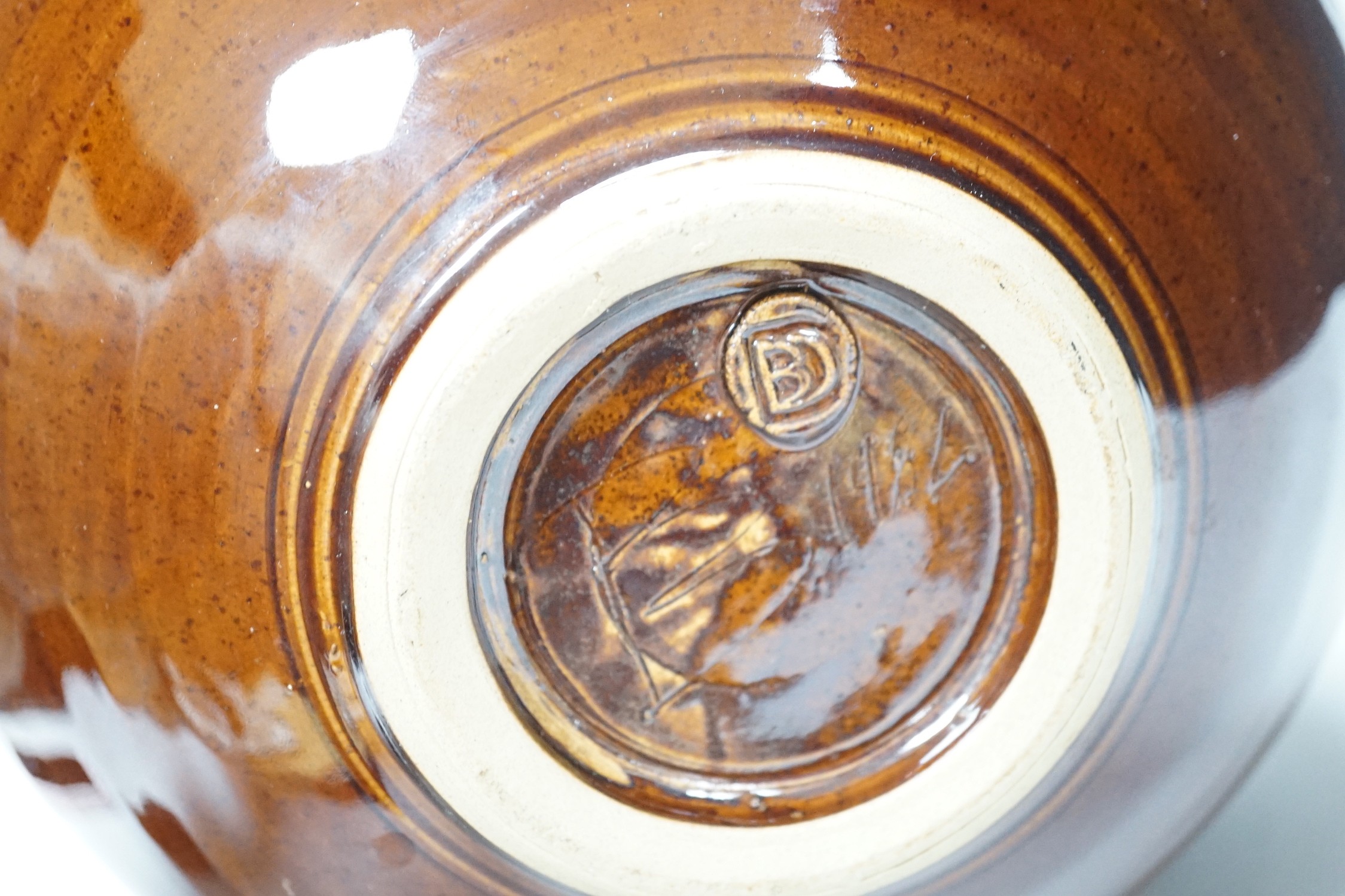 A Doug Bignell 'Alice in Wonderland' brown glazed teapot (a unique piece commissioned by the current owner), 30cms